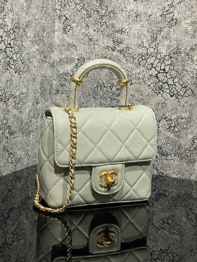 CHANEL- With Handle